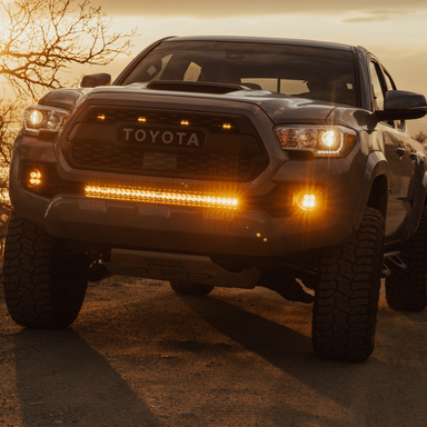 amber led behind the grille light bar mounted on a toyota tacoma